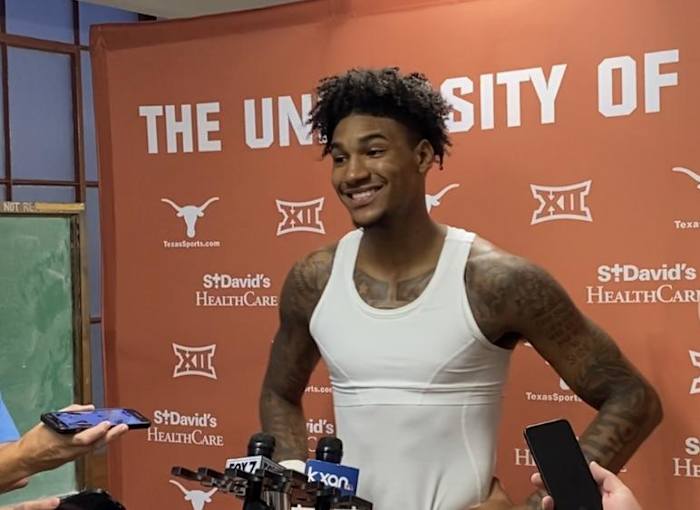 Dillon Mitchell talks to the media after the Orange-White scrimmage.